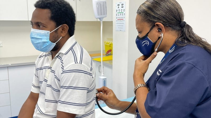 nurse examining patient
